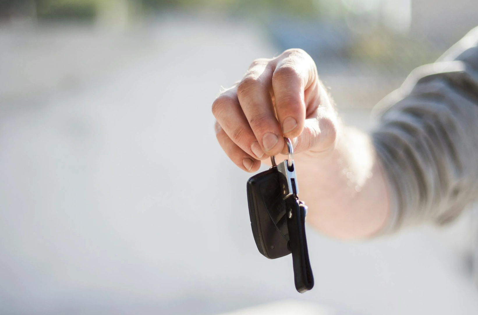 person holding car keys
